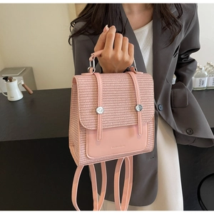 Close-up of pink woven texture and leather details on the stylish casual backpack