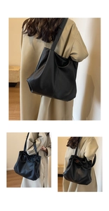 Three-angle view of large black leather tote bag with lychee texture on beige trench coat
