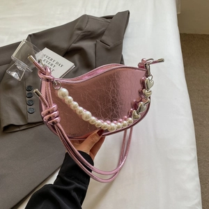 Metallic pink half-moon shoulder bag with pearl chain and silver heart pendant decoration