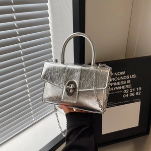Silver metallic pleated handbag with a rotary lock and chain strap for women
