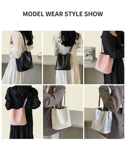 Vue détaillée du sac seau élégant en noir, rose, blanc et finitions argentées