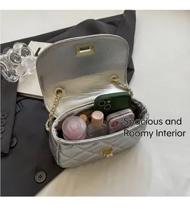 Silver quilted chain bag showing interior storage capacity for lipstick and phone