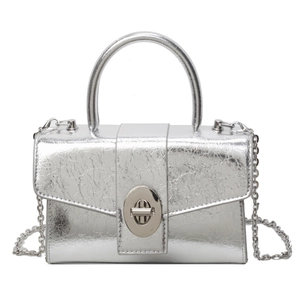 Silver metallic patent leather crossbody bag with chain strap and top handle