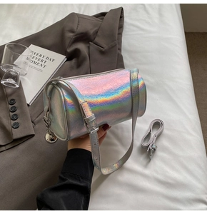 Detail of holographic pillow bag with silver zipper and adjustable shoulder strap
