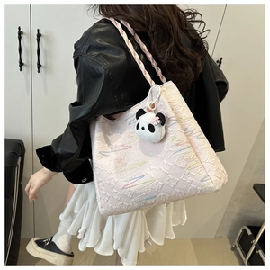Pink jacquard bucket bag with colorful wavy embroidery and a cute panda plush charm