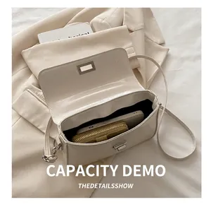Detailed interior view showing large capacity space of the cream-white flap crossbody bag