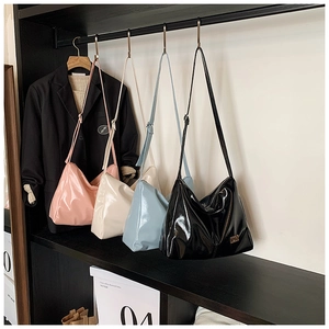 Glossy patent leather hobo tote bags for women in pink, white, blue, and black colors