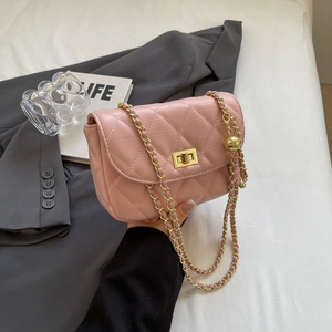 Quilted mini chain crossbody bag in pink with gold hardware and leather strap