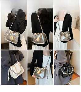 Detailed views of crossbody bucket bag with drawstring and metallic chain strap