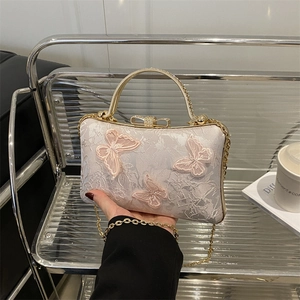 Pink satin evening clutch with floral embroidery, butterfly accents and gold metal handle