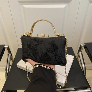 Elegant black evening bag with gold handles and butterfly embroidery for party wear