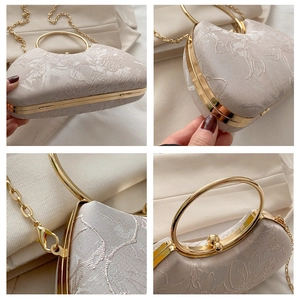 Detail shots of champagne evening clutch with floral embroidery and golden ring handle