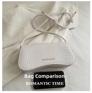 Detailed comparison of white moon bag with woven texture next to a smartphone