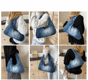 Detail van vintage denim schoudertas met patchwork stiksels en gewassen textuur