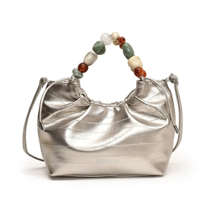 Silver metallic bucket bag with unique beaded handle and long leather shoulder strap