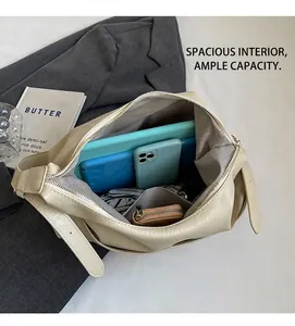 Top view of open beige tote bag showing large interior capacity with lining and zipper