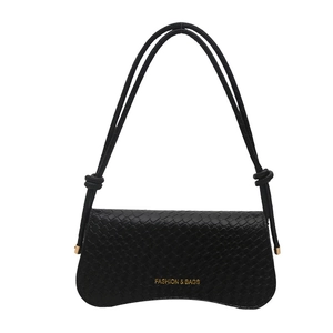 Black woven texture crossbody bag with gold hardware and a unique wavy base design