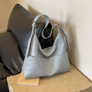 Light blue large capacity hobo bag with side pockets and adjustable shoulder strap