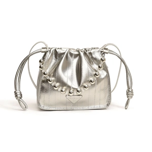 Silver metallic drawstring bucket bag with pleats and beaded chain handle for women