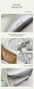 Detail view of silver textured handbag with metallic hardware and beige interior lining