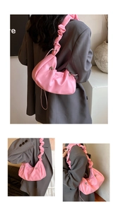 Pink dumpling shoulder bag with pleated texture and stylish scrunchie-style strap