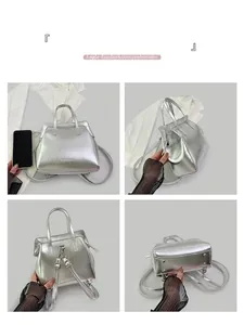 Detail view of silver metallic bag showing front, back and bottom with metal feet studs