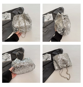 Detailed view of silver sequin bucket bag featuring metallic chain and drawstring closure