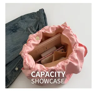 Top view of pink canvas tote interior with magnetic buckle and spacious storage