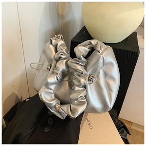 Detailed view of silver metallic pleated handbag with a stylish cloud-like texture
