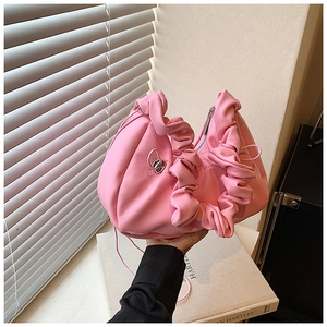 Detailed macro view of soft pink pleated PU leather texture and delicate drawstring detail