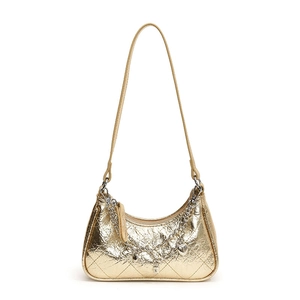 Metallic gold quilted baguette bag with heart charms and layered silver chains