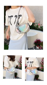 Macro view of holographic crescent bag with large pearls and heart-shaped metal charms
