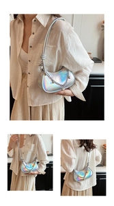 Detail of silver holographic crescent bag with metallic chain and pearl pendant