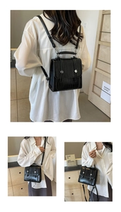 Detailed views of a black crocodile pattern backpack with silver metal hardware and straps