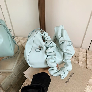 Chic mint blue pleated handbag with soft cloud handle and stylish drawstring details