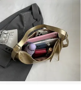 Detailed top view of a large gold textured tote bag showing its spacious interior capacity