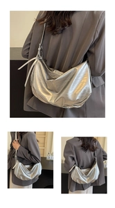 Macro detail of silver soft metallic tote bag showing textured PU leather and stylish pleats
