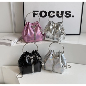 Detailed lineup of shiny bucket bags with metal ring handles and chain straps in four colors