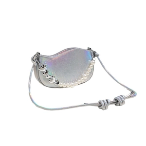 Holographic silver crescent handbag with pearl chain and heart charms on white background
