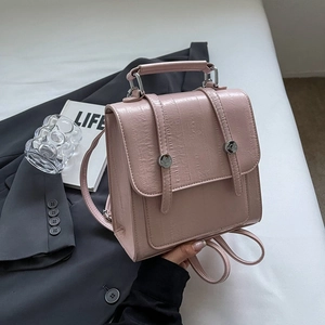 Pink ostrich pattern leather backpack with flap design and silver metal buttons