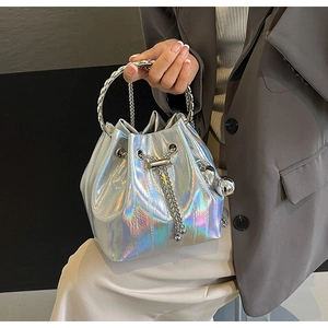 Detailed shot of holographic silver bucket bag with metal ring handle and chain drawstring