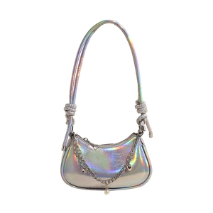 Iridescent silver underarm bag with knot handle and pearl chain charm accessory