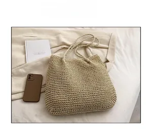 Detail of beige straw tote bag with woven texture on a minimalist lifestyle background