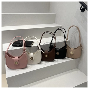 Detailed arrangement of crescent crossbody bags in five colors with circular metal locks