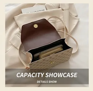 Detail shot showing internal capacity of the vintage pattern flap crossbody bag