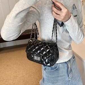 Quilted black chain crossbody bag with glossy finish and silver rectangular turn-lock