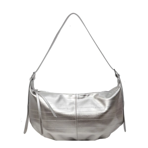 Silver metallic soft leather hobo tote bag with fringe tassels and spacious design