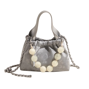 Silver metallic pleated bucket bag with beaded handle and chain strap for women