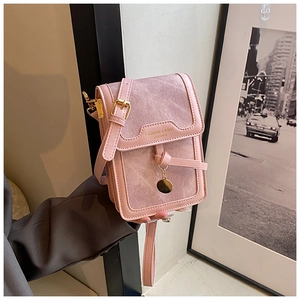 Pink minimalist crossbody phone bag with gold ring pendant and premium leather texture