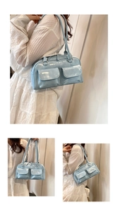 Detail showing the light blue patent leather shoulder bag with dual flap front pockets